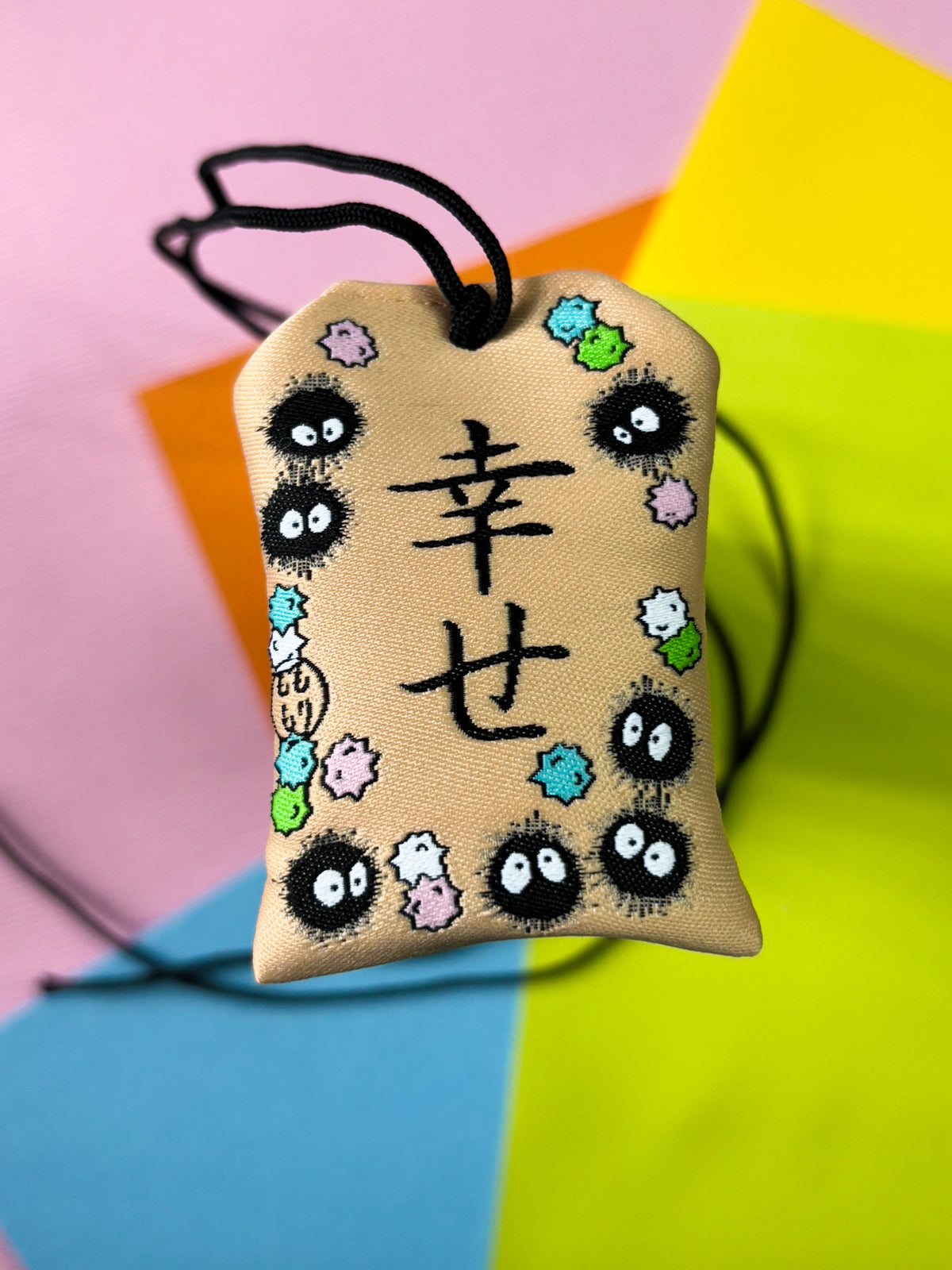 Japanese good luck charm (omamori) based on the Studio Ghibli movie Spirited Away. Based on the Soot Sprite characters.