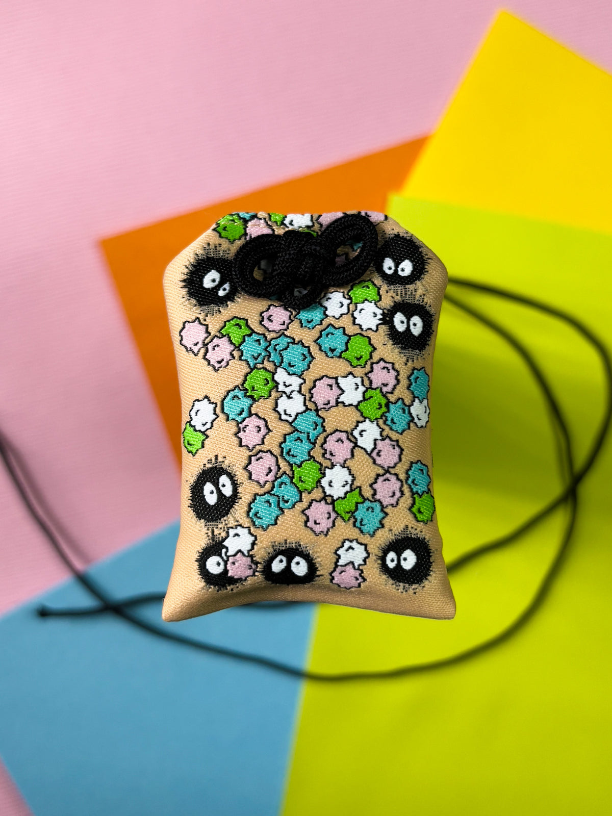 Japanese good luck charm (omamori) based on the Studio Ghibli movie Spirited Away. Based on the Soot Sprite characters.